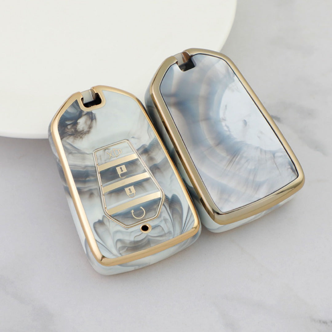 Isuzu Autoschlüsseletui, goldfarben mit Jade-Einlage